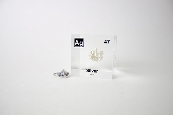 Clear acrylic cube displaying a Silver element (Atomic Number 47) embedded within, offering a scientific presentation for collectors and science enthusiasts.