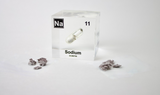Clear acrylic cube containing a Sodium ampule, marked with its atomic number 11. Perfect for showcasing in educational environments, scientific collections, or as a unique decorative element.