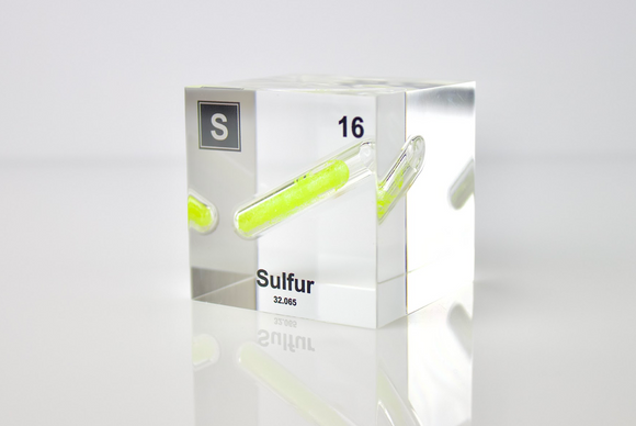 Clear acrylic cube displaying a Sulfur element (Atomic Number 16) embedded within, offering a scientific presentation for collectors and science enthusiasts.