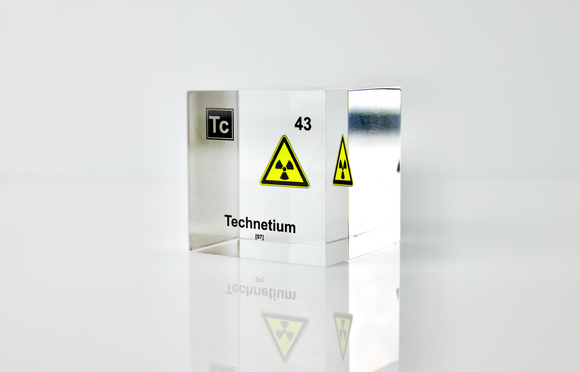 Clear acrylic cube displaying a Technetium element (Atomic Number 43) embedded within, offering a scientific presentation for collectors and science enthusiasts.