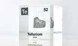 Clear acrylic cube displaying a Tellurium element (Atomic Number 52) embedded within, offering a scientific presentation for collectors and science enthusiasts.