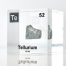 Clear acrylic cube displaying a Tellurium element (Atomic Number 52) embedded within, offering a scientific presentation for collectors and science enthusiasts.