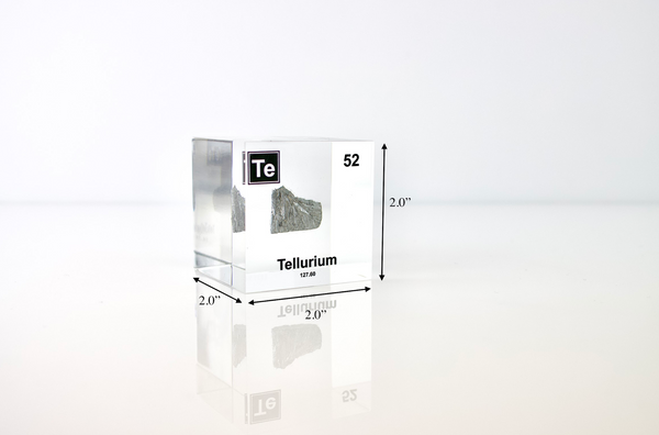 Clear acrylic cube displaying a Tellurium element (Atomic Number 52) embedded within, offering a scientific presentation for collectors and science enthusiasts.