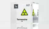 Clear acrylic cube displaying a Tennessine element (Atomic Number 117) embedded within, offering a scientific presentation for collectors and science enthusiasts.