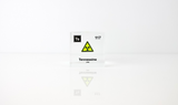 Clear acrylic cube displaying a Tennessine element (Atomic Number 117) embedded within, offering a scientific presentation for collectors and science enthusiasts.