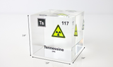 Clear acrylic cube displaying a Tennessine element (Atomic Number 117) embedded within, offering a scientific presentation for collectors and science enthusiasts.