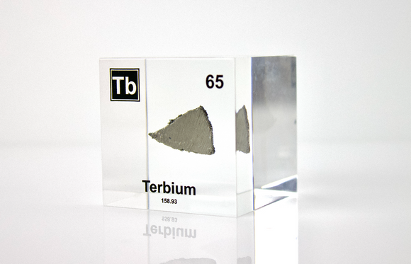 Clear acrylic cube displaying a Terbium element (Atomic Number 65) embedded within, offering a scientific presentation for collectors and science enthusiasts.