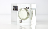 Clear acrylic cube displaying a Tin element (Atomic Number 50) embedded within, offering a scientific presentation for collectors and science enthusiasts.