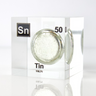 Clear acrylic cube displaying a Tin element (Atomic Number 50) embedded within, offering a scientific presentation for collectors and science enthusiasts.