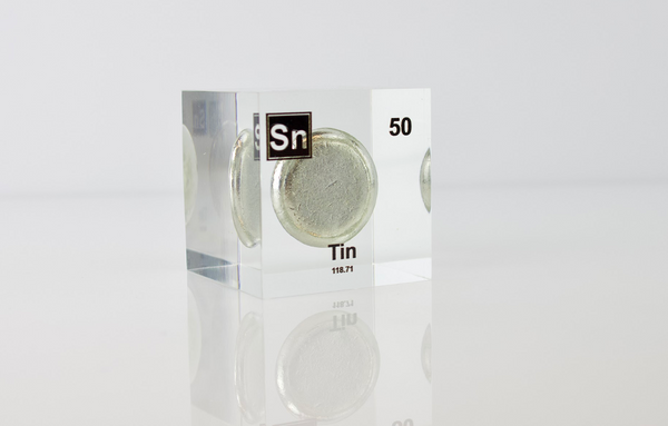 Clear acrylic cube displaying a Tin element (Atomic Number 50) embedded within, offering a scientific presentation for collectors and science enthusiasts.