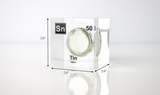 Clear acrylic cube displaying a Tin element (Atomic Number 50) embedded within, offering a scientific presentation for collectors and science enthusiasts.