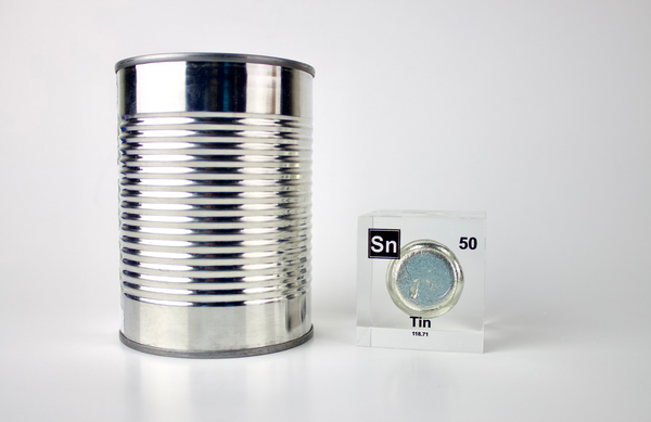 Clear acrylic cube displaying a Tin element (Atomic Number 50) embedded within, offering a scientific presentation for collectors and science enthusiasts.