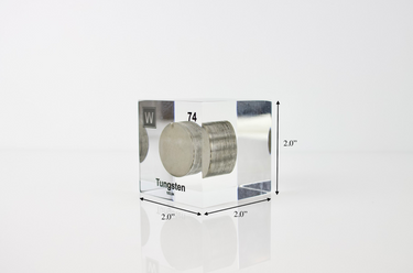 Clear acrylic cube displaying a Tungsten element (Atomic Number 74) embedded within, offering a scientific presentation for collectors and science enthusiasts.