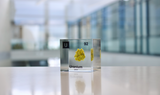Clear acrylic cube displaying a Uranium element (Atomic Number 92) embedded within, offering a scientific presentation for collectors and science enthusiasts.