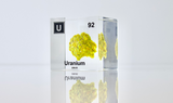 Clear acrylic cube displaying a Uranium element (Atomic Number 92) embedded within, offering a scientific presentation for collectors and science enthusiasts.