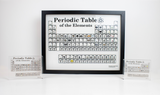 Wall mounted periodic table of elements in between two smaller periodic table of elements with real elements in it