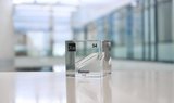 Clear acrylic cube displaying a Xenon element (Atomic Number 54) embedded within, offering a scientific presentation for collectors and science enthusiasts.