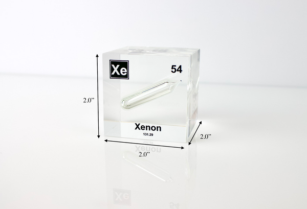 Clear acrylic cube displaying a Xenon element (Atomic Number 54) embedded within, offering a scientific presentation for collectors and science enthusiasts.