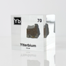 Clear acrylic cube displaying an Ytterbium element (Atomic Number 70) embedded within, offering a scientific presentation for collectors and science enthusiasts.