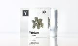 Clear acrylic cube displaying a Yttrium element (Atomic Number 39) embedded within, offering a scientific presentation for collectors and science enthusiasts.
