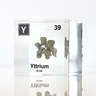 Clear acrylic cube displaying a Yttrium element (Atomic Number 39) embedded within, offering a scientific presentation for collectors and science enthusiasts.