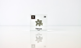 Clear acrylic cube displaying a Yttrium element (Atomic Number 39) embedded within, offering a scientific presentation for collectors and science enthusiasts.