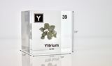 Clear acrylic cube displaying a Yttrium element (Atomic Number 39) embedded within, offering a scientific presentation for collectors and science enthusiasts.