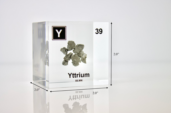 Clear acrylic cube displaying a Yttrium element (Atomic Number 39) embedded within, offering a scientific presentation for collectors and science enthusiasts.