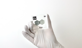 Zinc element encased in a clear acrylic cube, featuring its name, atomic number 30, and properties as displayed on the periodic table. Ideal for educational and collector use.