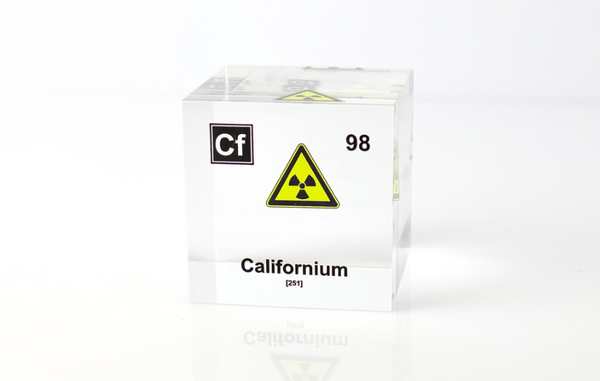 Clear acrylic cube displaying a Californium element (Atomic Number 98) embedded within, offering a scientific presentation for collectors and science enthusiasts.