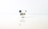 Clear acrylic cube displaying an Indium element (Atomic Number 49) embedded within, offering a scientific presentation for collectors and science enthusiasts.