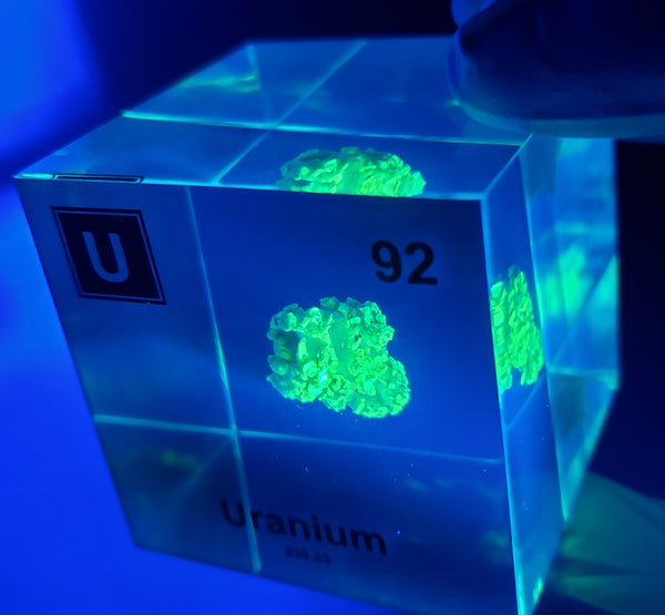 Clear acrylic cube displaying a Uranium element (Atomic Number 92) embedded within, offering a scientific presentation for collectors and science enthusiasts.